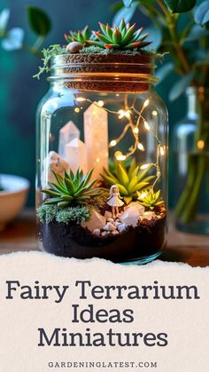 a glass jar filled with plants and rocks on top of a table next to candles