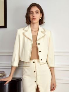 Editor's Notesyyiam curates feminine and classic daily outfits that suit well to modern women.- Crop jacket design- Made of tweed fabric- Button-down design- Vintage gold buttons- Feminine and sophisticated mood Measurements(in.)[S / M]- Length: 16.93 in. / 17.32 in. - Shoulder Length: 16.93 in. / 17.32 in. - Waistline: 31.89 in. / 33.46 in.- Bust: 38.16 in. / 39.76 in.- Sleeve Length: 18.90 in. / 19.29 in.* Model info: Size S / Height 5' 7 Composition & Care- Material: 78% Polyester, 20% Cotton, 2% Nylon- Light hand wash or dry cleaning recommended Designer- by yyiam Elegant Beige Tweed Jacket With Lapel Collar, Elegant Beige Tweed Jacket With Suit Collar, Elegant Button-up Tweed Jacket For Office, Chic Cream Tweed Blazer, Elegant Gold Tweed Jacket For Work, Beige Button-up Tweed Jacket With Buttons, Chic Beige Tweed Jacket For Office, Luxury Spring Tweed Jacket With Button Closure, Elegant Workwear Blazer With Pearl Buttons