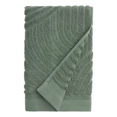 a green towel folded on top of each other