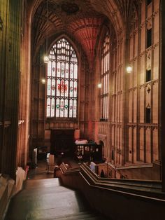 an old building with stained glass windows and stairs