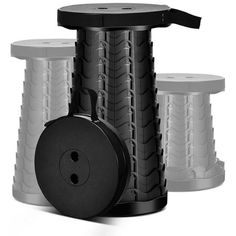 three black and white spools are stacked on top of each other with wheels