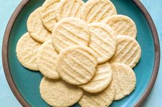 a blue plate filled with cookies on top of a table