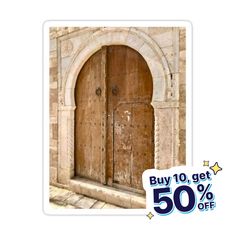 an old wooden door with a sale sign next to it that says buy 10 get 50 % off