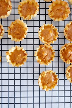 some food is sitting on a cooling rack and ready to be cooked in the oven