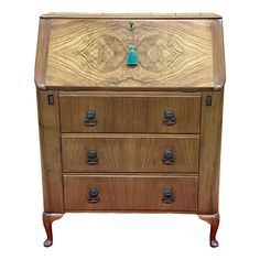 an old wooden dresser with drawers and knobs