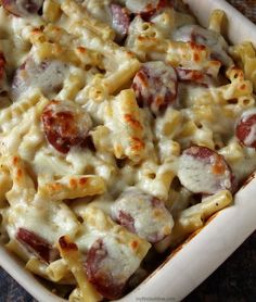 a casserole dish filled with pasta and sausage