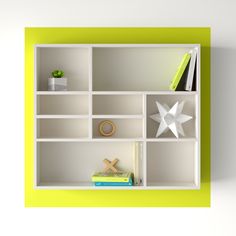 a white shelf with books and other items on it