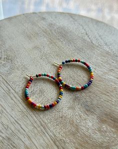 Beautiful beaded hoop earrings on a gold nickel free hoop Everyday Small Hoop Beaded Earrings With Colorful Beads, Everyday Colorful Beaded Small Hoop Earrings, Hoop Beaded Earrings With Spacer Beads, Nickel-free Multicolor Hoop Earrings, Everyday Colorful Bead Hoop Earrings, Everyday Colorful Beads Hoop Earrings, Everyday Colorful Beaded Hoop Earrings, Multicolor Small Hoop Beaded Earrings For Everyday, Everyday Small Hoop Earrings With Colorful Beads