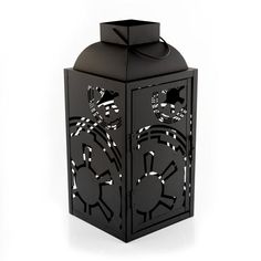 a black lantern with an intricate design on it