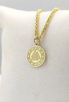 14K Solid Gold Valknut Necklace - Viking Pendant - Gold Norse Jewelry  Find all the information you need about your pendant : Material: 14K Solid Real Gold Stamp: 585 (14K) Pendant's Size: ( 6 sizes available) -       0.55 inches / 14mm  (diameter) -       0.62 inches / 16mm (diameter) -0.70 inches / 18mm (diameter) -0.78 inches / 20mm (diameter) -0.86 inches / 22mm (diameter) -0.94 inches / 24mm (diameter) Pendant Thickness: 0.5mm Inner diameter of the jumpring: 4mm FREE Backside Engraving Gift Box Included! Chain Information: Rolo Chain - 0.70mm thick - 16 inches / 40cm - 18 inches / 45cm - 20 inches / 50cm - 22 inches / 55cm Rope Chain - 2.10mm thick - 16 inches / 40cm - 18 inches / 45cm - 20 inches / 50cm - 22 inches / 55cm Veneziana Chain - 0.65mm thick - 16 inches / 40cm - 18 inches Knot Jewelry, Norse Jewelry, Viking Pendant, Jewelry Knots, Pendant Gold, Rolo Chain, Gold Style, Real Gold, Necklace Gold