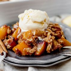 a close up of a plate of food with fruit and ice cream on the top