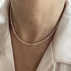 "This classic necklace is made from high quality genuine AAA grade 4.5mm semi-round round pink all natural fine freshwater pearls with peach undertones, with a high luster. A delicate, feminine & classy necklace perfect for all occasions and bridal too. These pearls have a rich luster, are perfectly calibrated, and are uniform in size.  Pearls have an international grading scale, these beautiful pearls are graded as follows: surface: AAA luster: AAA round: AA+ - Photos taken outside in natural l Classic Pink Pearl Chain Jewelry, Classic Rose Gold Necklaces With Round Beads, Delicate Pink Pearl Necklace With Pearl Chain, Delicate Pink Pearl Chain Necklace, Classic Rose Gold Pearl Drop Necklace, Pink Akoya Pearl Single Strand Necklace, Classic Pink Pearl Drop Necklace, Classic Rose Gold Pearl Charm Necklace, Pink Akoya Pearl Necklaces With Round Beads