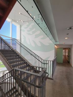 an empty building with stairs leading up to the second floor