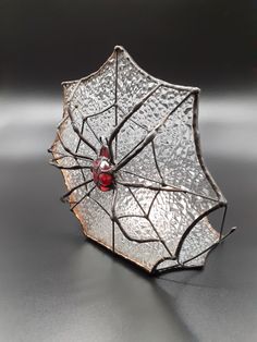 a glass umbrella with a ladybug on it