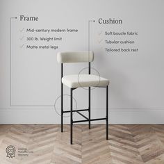 a white chair sitting on top of a hard wood floor next to a wall with measurements