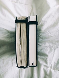 an open book sitting on top of a white sheet