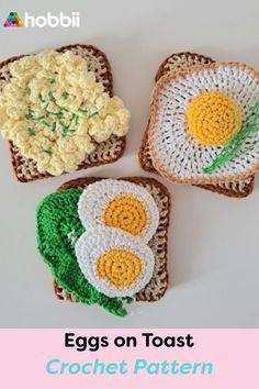 three crocheted eggs on toast with green leaves and white flowers in the middle