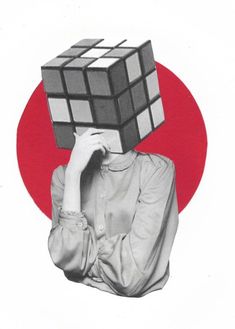 a woman covering her face with a cube on top of her head