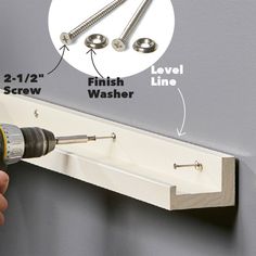 a drill is being used to fix screws on the side of a wall with measurements