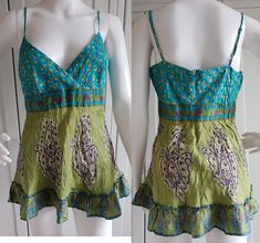 * Vintage women tank top by Warehouse * Blue / Green color * 100% Silk Size - UK 12 / US 8 / EUR 40 Length - 28 inch / 71 cm Bust - 36 inch / 92 cm Waist - 30 inch / 76 cm Hips - 38 inch / 96 cm You can also check other items from my shop: https://www.etsy.com/shop/FadoVintageShop Thank you for visiting my shop! Green Cotton V-neck Tank Top, Cotton Vest Top For Vacation, Fitted Sleeveless Top For Vacation, Green Cotton Camisole For Vacation, Fitted Green Vest Top, Green Cotton Camisole, Cotton V-neck Vest Top, Green Cotton Summer Tank Top, Green Summer Cotton Tank Top