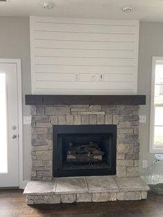 a living room with a fire place in it