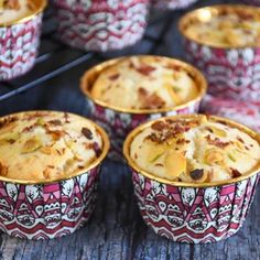 several small cups with food in them sitting on a table