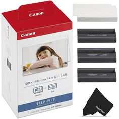 four canon black toner cartridges in a box with the package next to each other