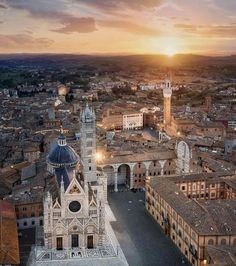 an aerial view of a city at sunset