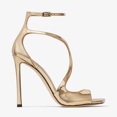 Daring and distinct, our AZIA sandals are presented in gold liquid metal leather and showcase signature delicate curved straps that flatteringly snake up your feet. This Italian-crafted pair features a slim heel and a modern square toe. Jimmy Choo Gold, Gold High Heels, Prom Dress Shoes, Gladiator Heels, Womens Sandals Summer, Designer Pumps, Leather Lingerie, Boot Pumps, Fine Jewelry Designers