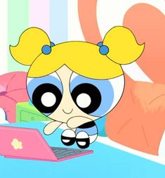 the powerpuff character is sitting in front of a laptop computer on her bed