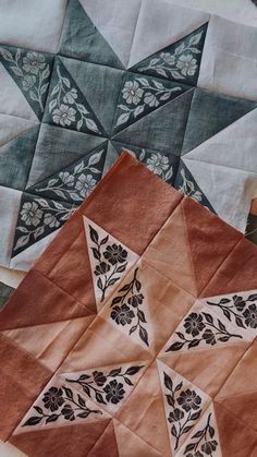 an image of some very pretty quilts on the table