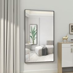 a large mirror in the corner of a room