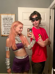 two people in costumes standing next to each other