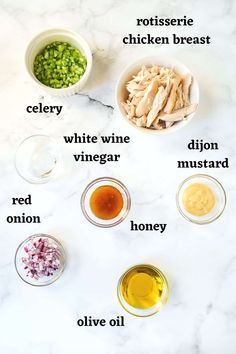 ingredients to make chicken salad laid out on a marble counter top with text overlay