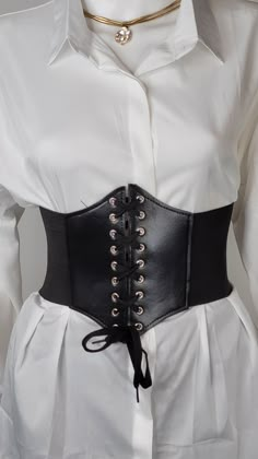 Renaissance Black Corset Belt. Embellish what you wear! Wearing this corset belt with long blouses, T-Shirts or your favorite dress, will update every outfit. Women’s beautiful form-fitting lace-up Corset Belt cinches your waistline. Wide Lace-Up Elastic Belt, great for waist training, fashion and accessories. Ships from a small business in GeorgiaMaterials: PU Leather, Leather, Faux LeatherDescriptionRenaissance Black Corset Belt. Embellish what you wear. Women’s beautiful form-fitting lace-up Belt For Women Fashion, Black Corset Outfit Formal, Cinch Belt With Dress, Leather Waist Belt Outfits, Stomach Belt Fashion, Small Corset Belt, Corset Belt Over Dress, Corset On Dress Outfit, Black Dress Corset Outfit