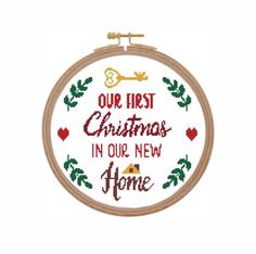 a cross stitch christmas ornament with the words our first christmas in our new home