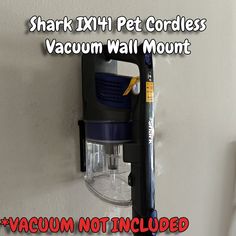 the shark x1 pet cordless vacuum wall mount is attached to a wall with a screwdriver