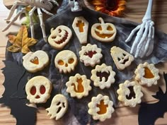 halloween treats are arranged in the shape of skulls and jack - o'- lanterns