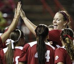 the women's soccer team is congratulating each other