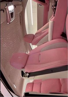 the interior of a car with pink leather seats