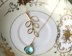 READY TO SHIP! Aquamarine Lariat Necklace Aqua Blue Lariat Leaf Gold Necklace - Bridal Necklace - Bridesmaid Lariat Necklace - Bridesmaid Jewelry Wedding The aquamarine gem is 13mm with 5mm thickness at the widest part. It is 14k gold plated. The chain is 14k gold filled and measures 2mm X 1.4mm. It is a flat cable design. The length of this particular necklace is approximately 16.5 inches. The leaf measures 18mm x 39mm. If you need a different length, no problem! Please just let me know when yo Blue Gemstone Necklace, Aquamarine Gem, Jewelry Wedding, Blue Gemstones, Lariat Necklace, Bridal Necklace, Dream Jewelry, Bridesmaid Jewelry, Jewelry Patterns