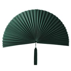 a large green fan with a black tassel hanging from it's center point