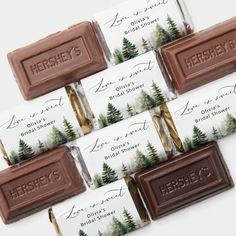 six hershey's chocolate bars are lined up in front of each other with trees on them