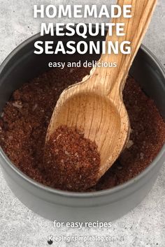 homemade mesoutee seasoning in a pot with a wooden spoon inside it