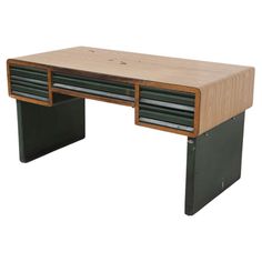 a wooden desk with two drawers on the top and one drawer open to show what's inside