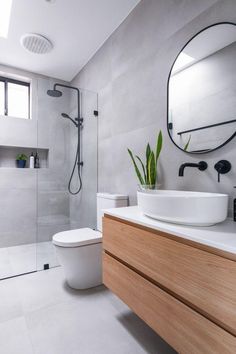 a bathroom with a sink, toilet and shower