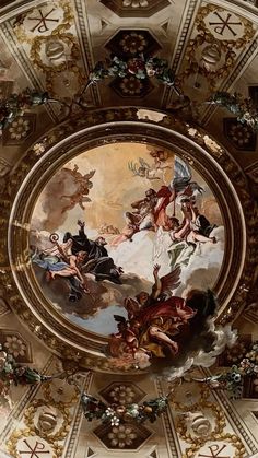 an ornate ceiling with paintings on it