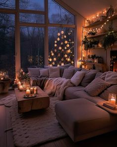 a living room filled with lots of furniture next to a window covered in christmas lights