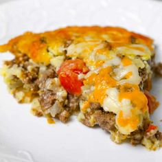 a slice of pizza on a plate with cheese and tomato toppings, ready to be eaten