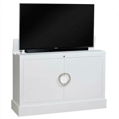 a white entertainment center with a flat screen tv on it's top and bottom shelf